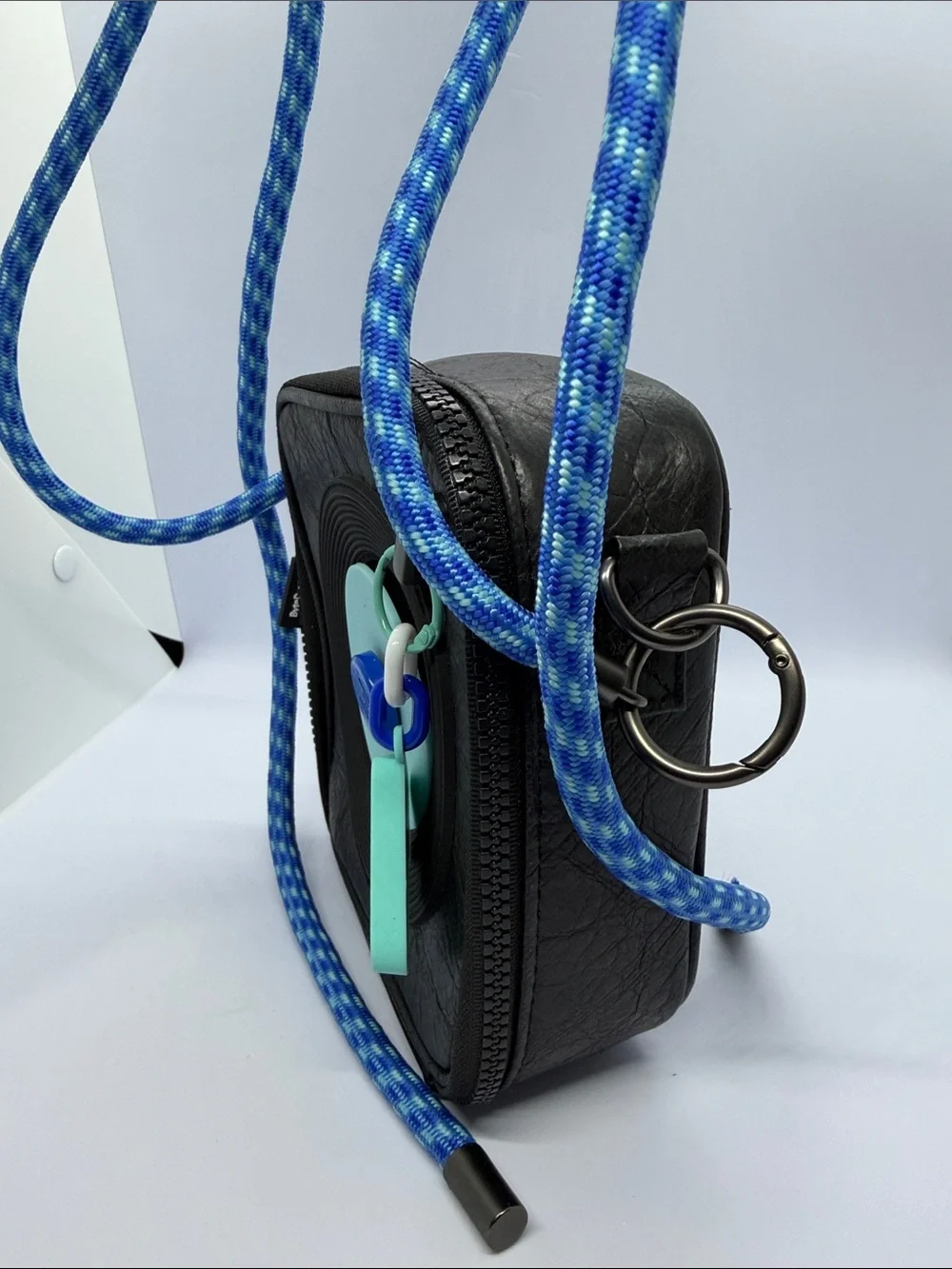 Black Camera Bag with Blue Woven Strap and Aqua Accent